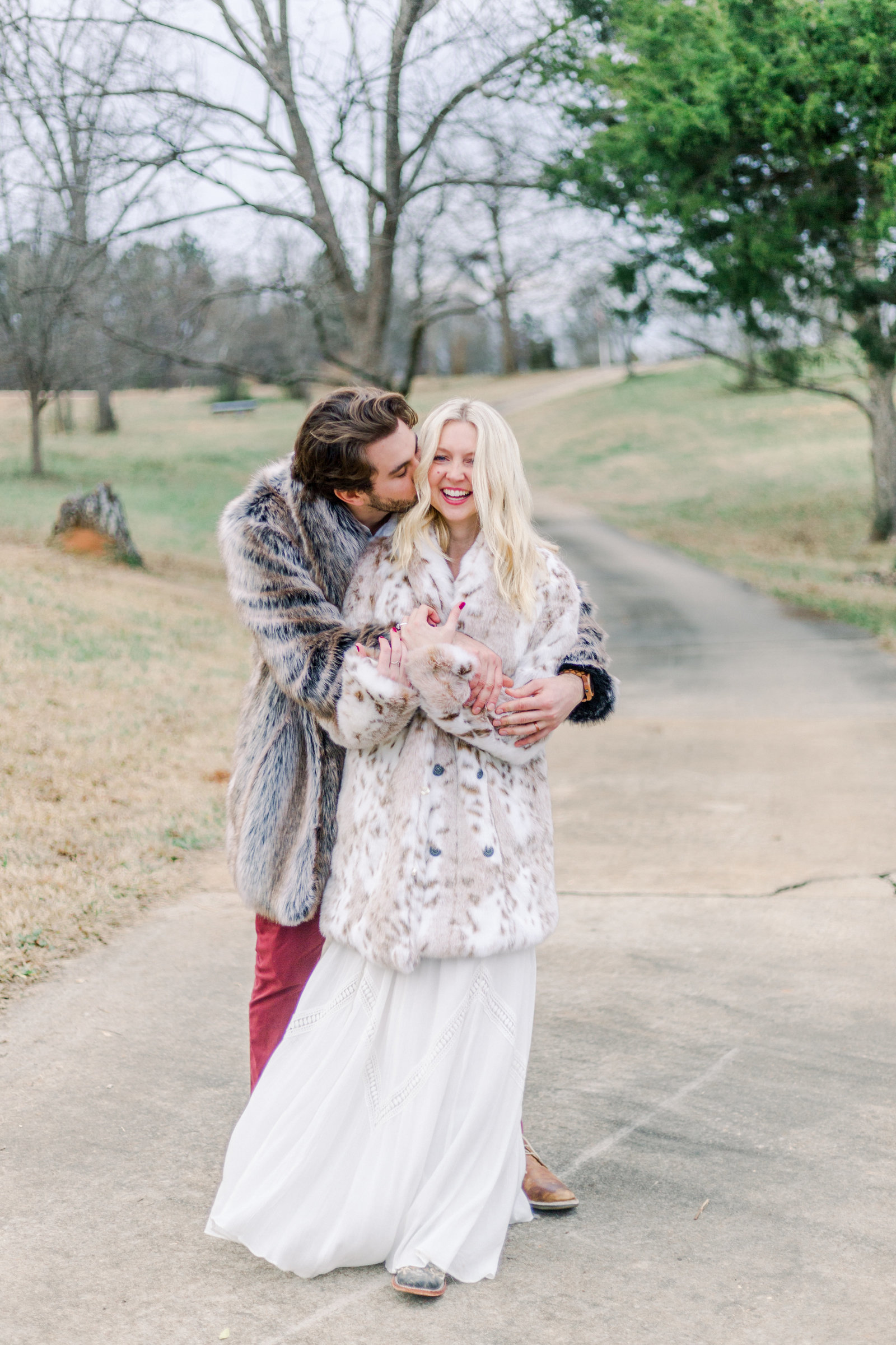 Couple smiling and hugging captured by Staci Addison Photography