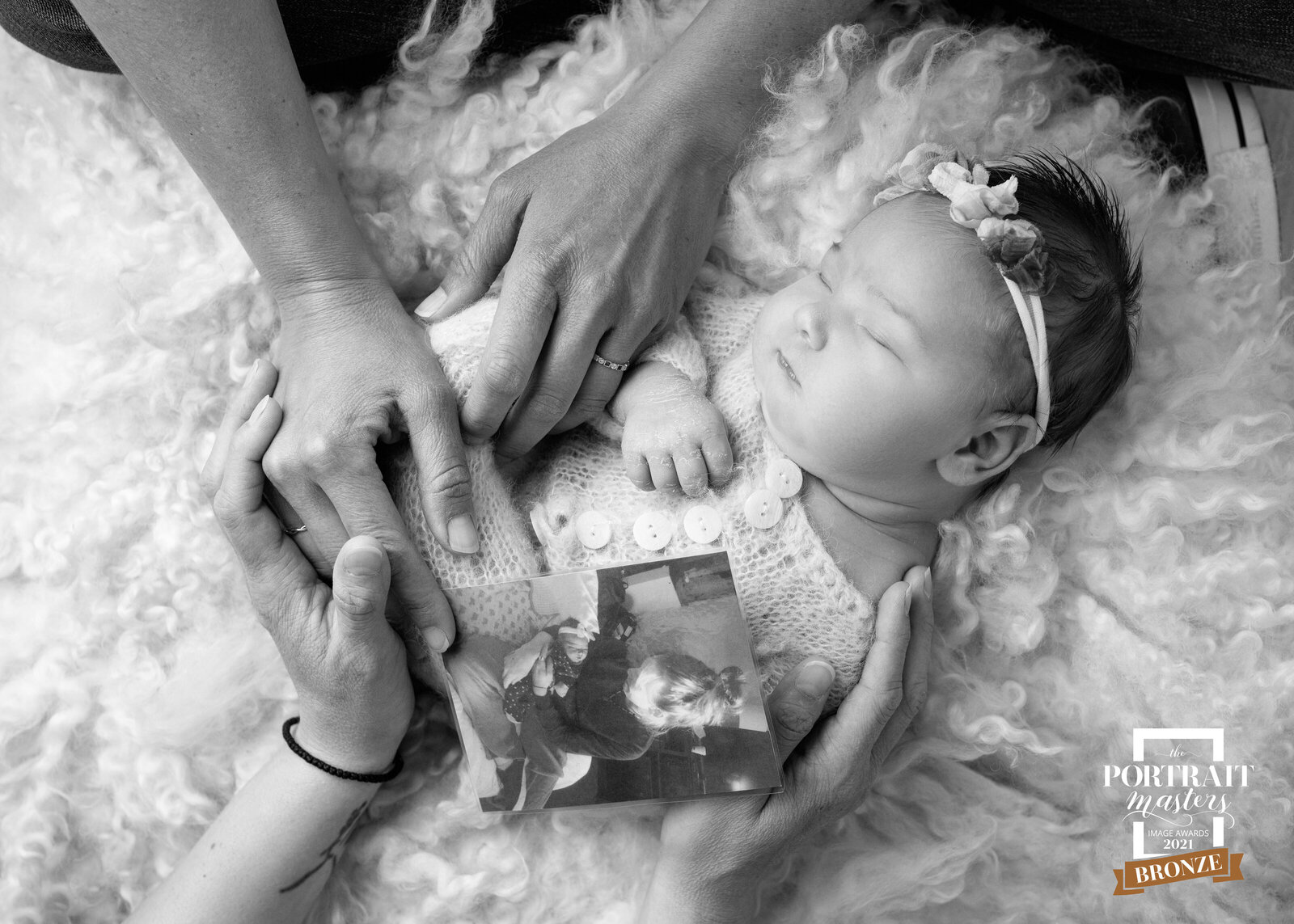 family newborn portrait with family hands black and white