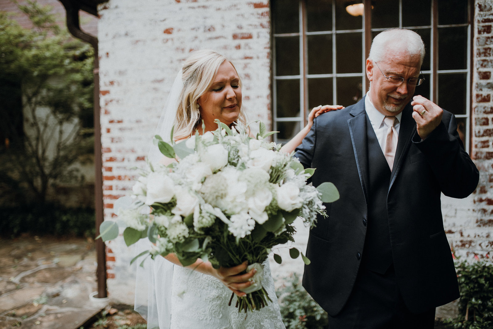 Bride and her father share a first look at  her Pratt Place Inn and Barn, Fayetteville AR wedding
