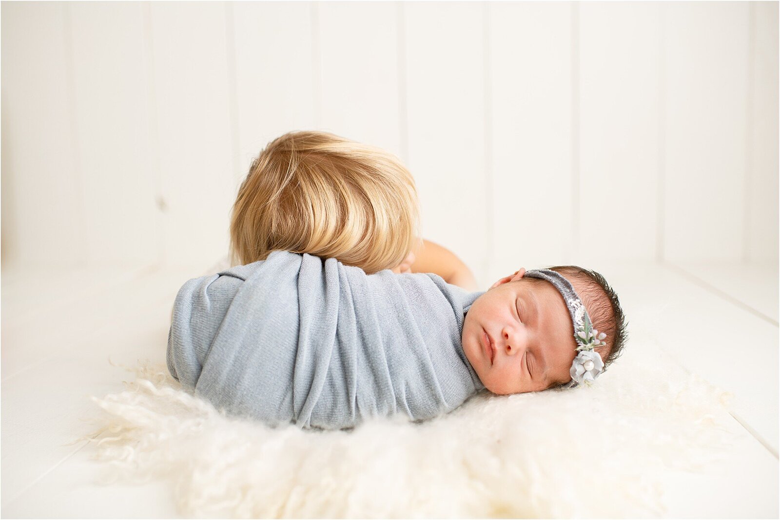newborn baby with sibling