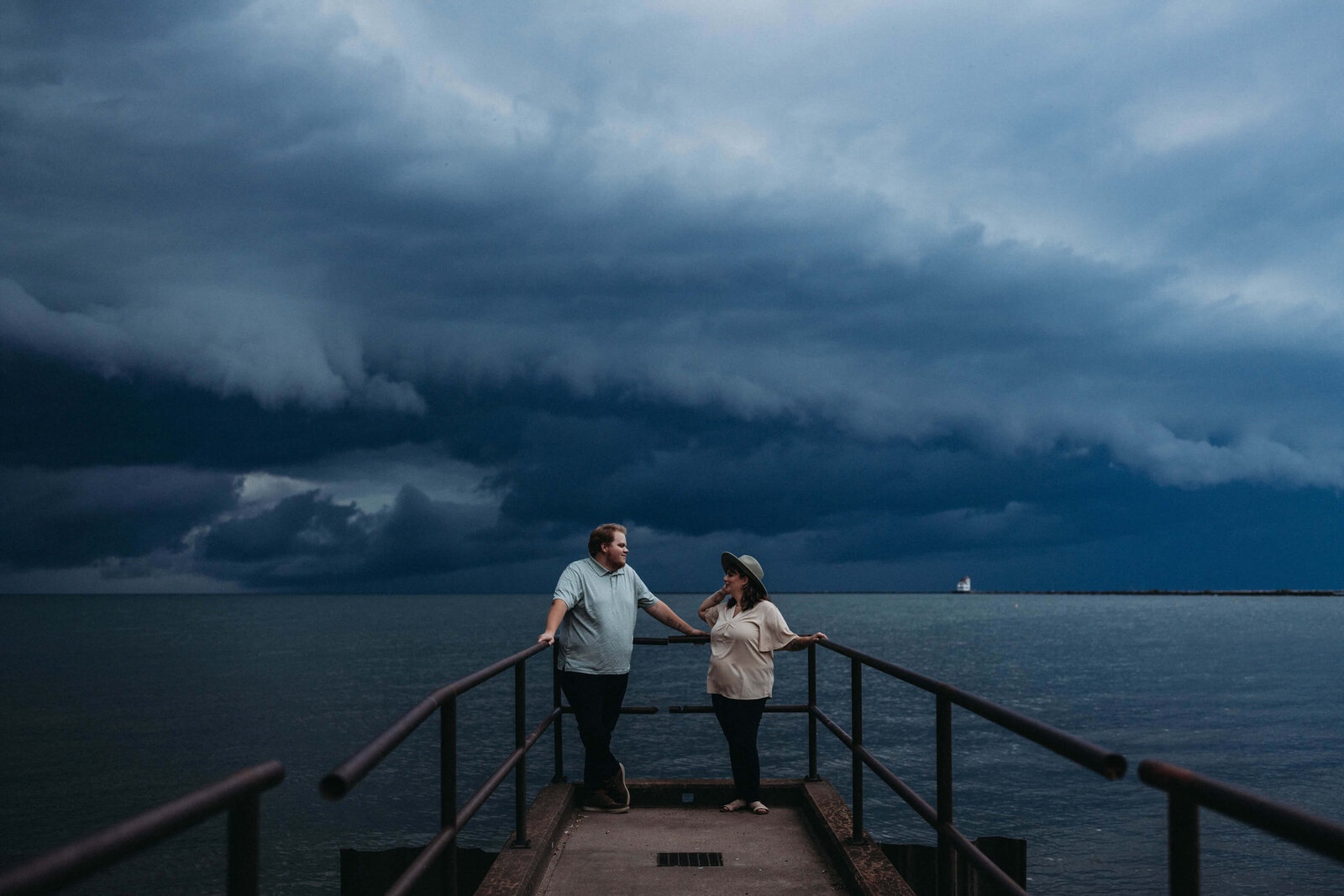 Partners pose at incoming storm in Cleveland, unique photo