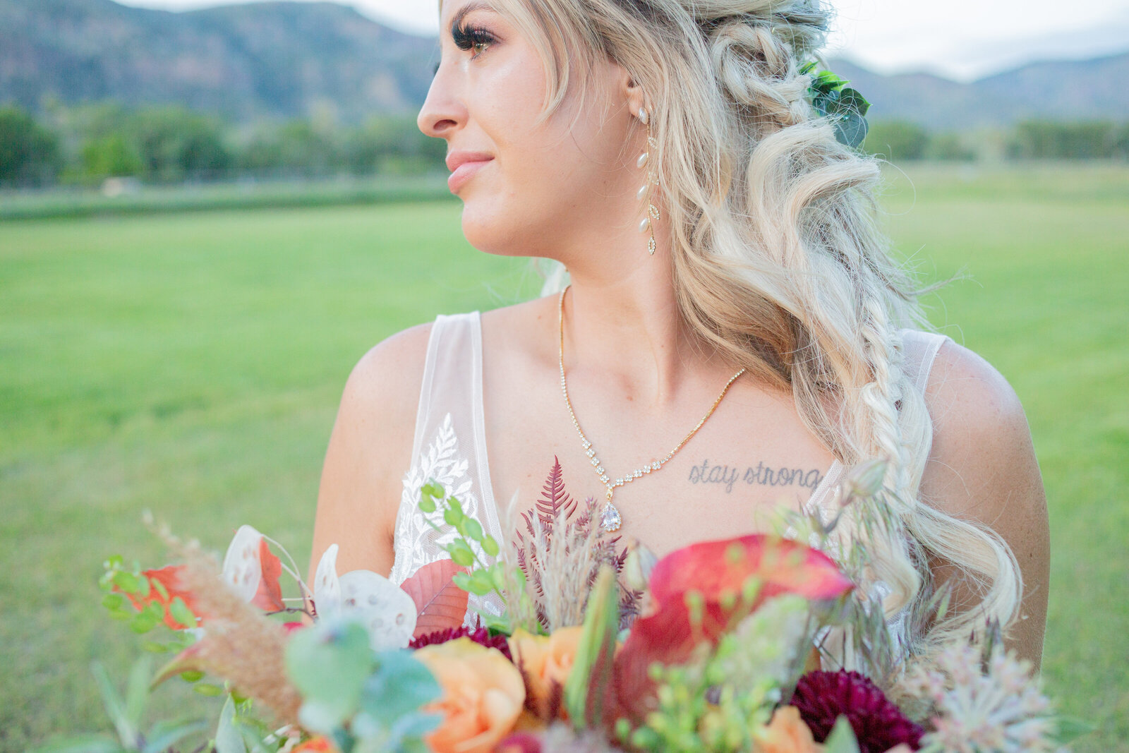 Seattle Wedding Photographers capture bride holding bouquet during outdoor wedding portraits