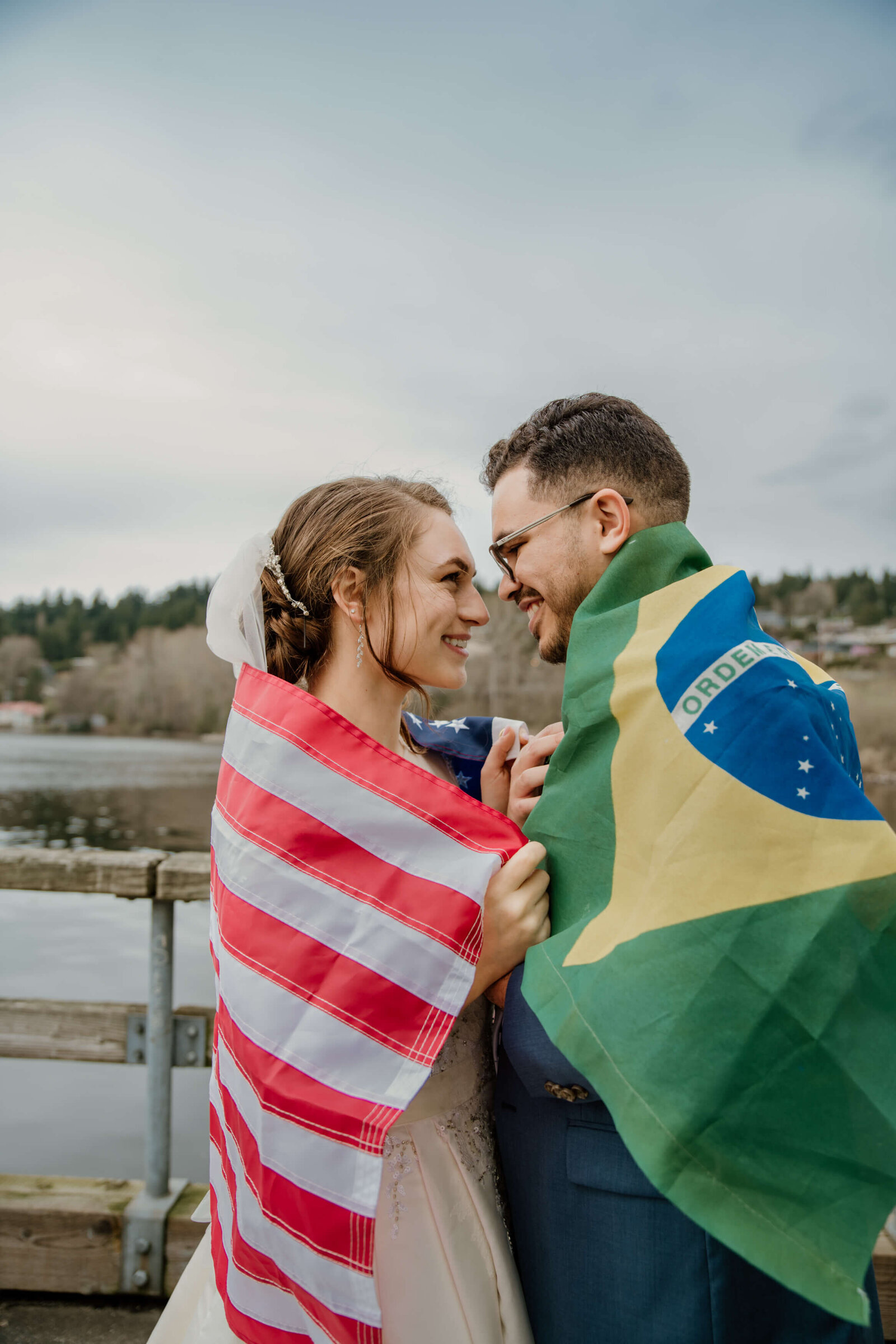 Bride and Groom together wearing their Countrys flags.