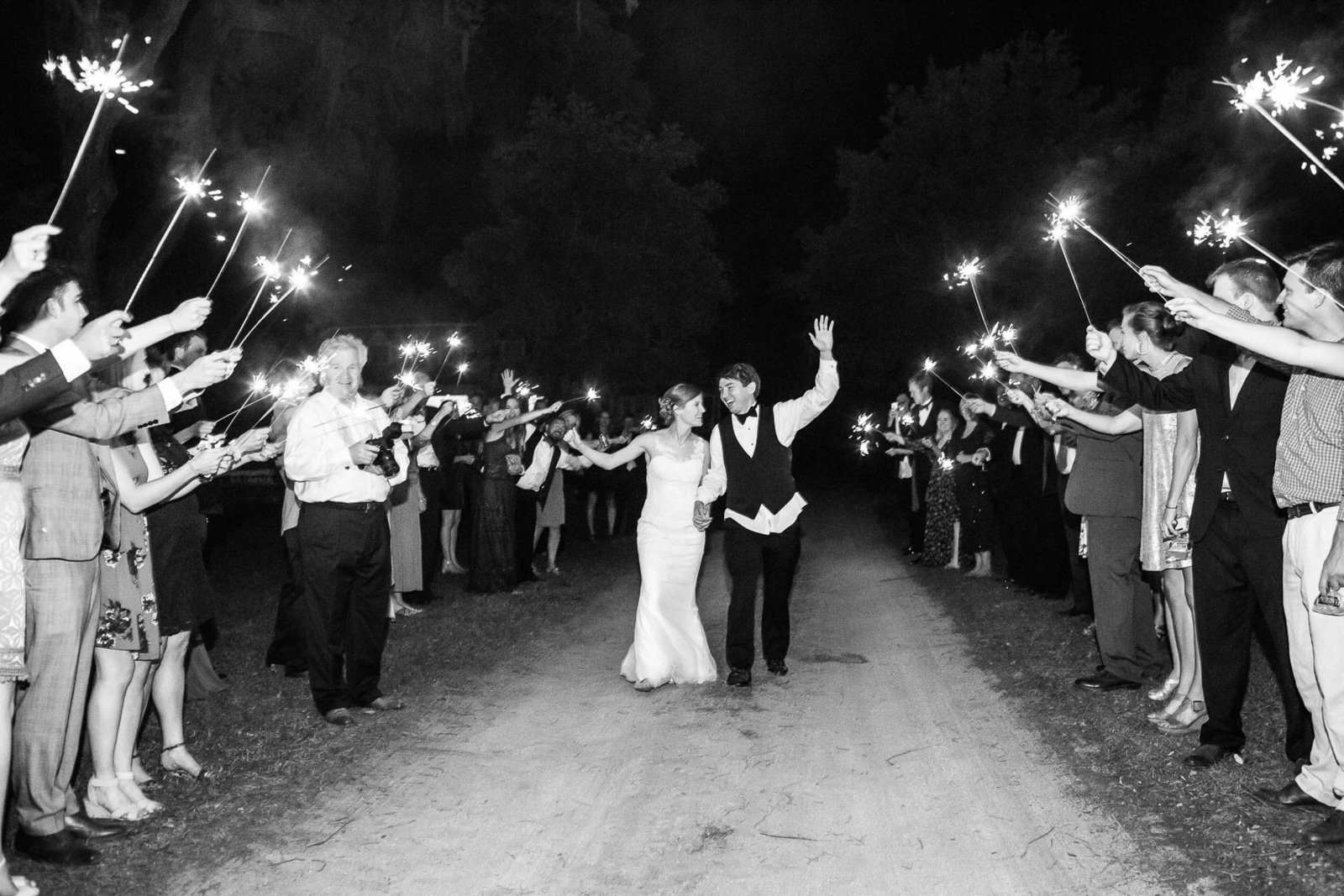 Bride and groom run down sparkler exit, Oakland Plantation, Mt Pleasant, South Carolina