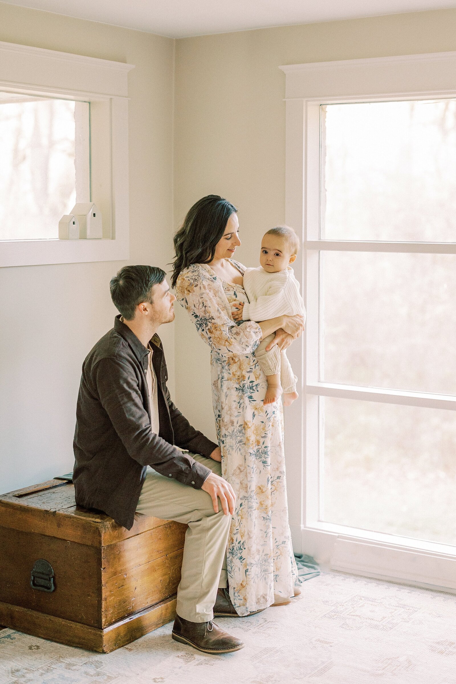 indoor portrait of family of 3 at home