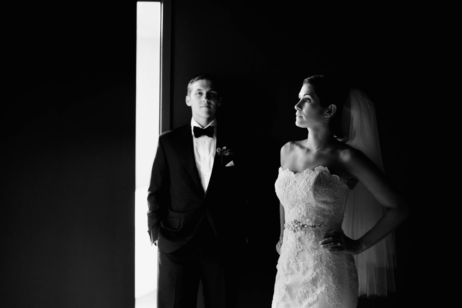 bride and groom in window light
