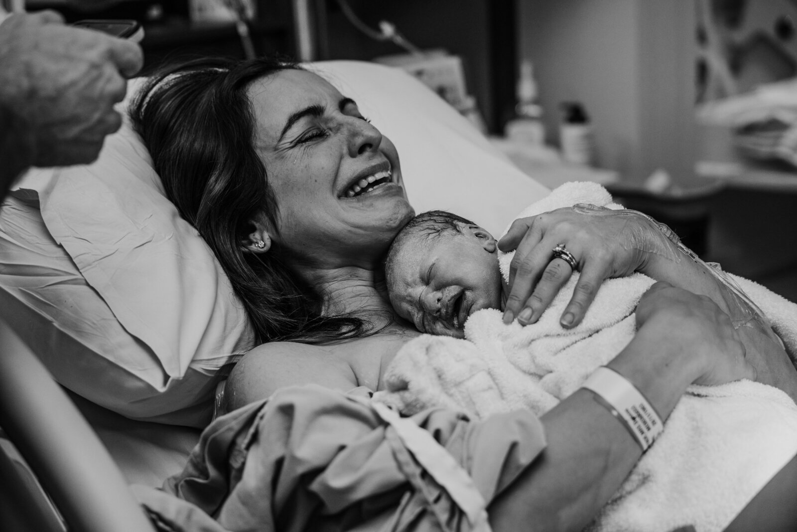 Epidural Birth at Fiona Stanley hospital, mumma holding her newborn baby