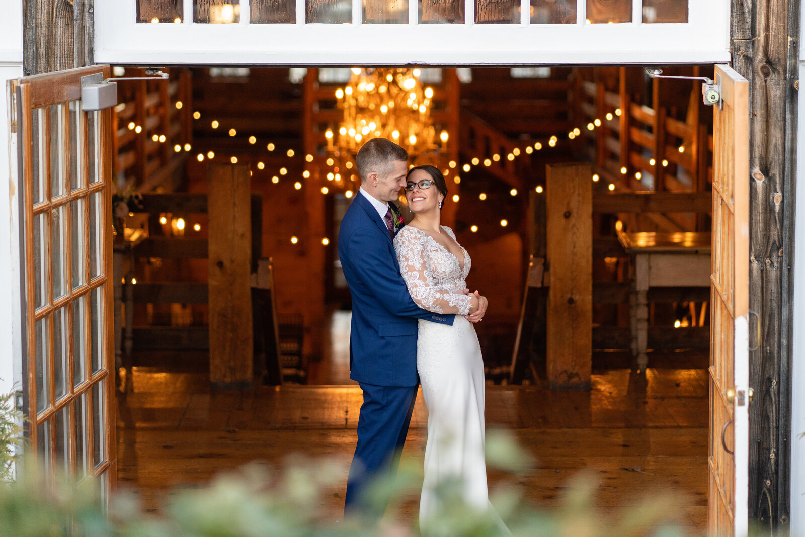 couple in thd doorway of the barn at the red lion inn cohasset