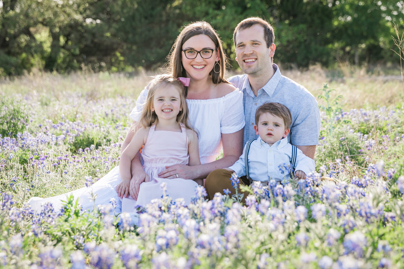 Austin Family Photographer, Tiffany Chapman Photography family smiling in bluebonnets photo