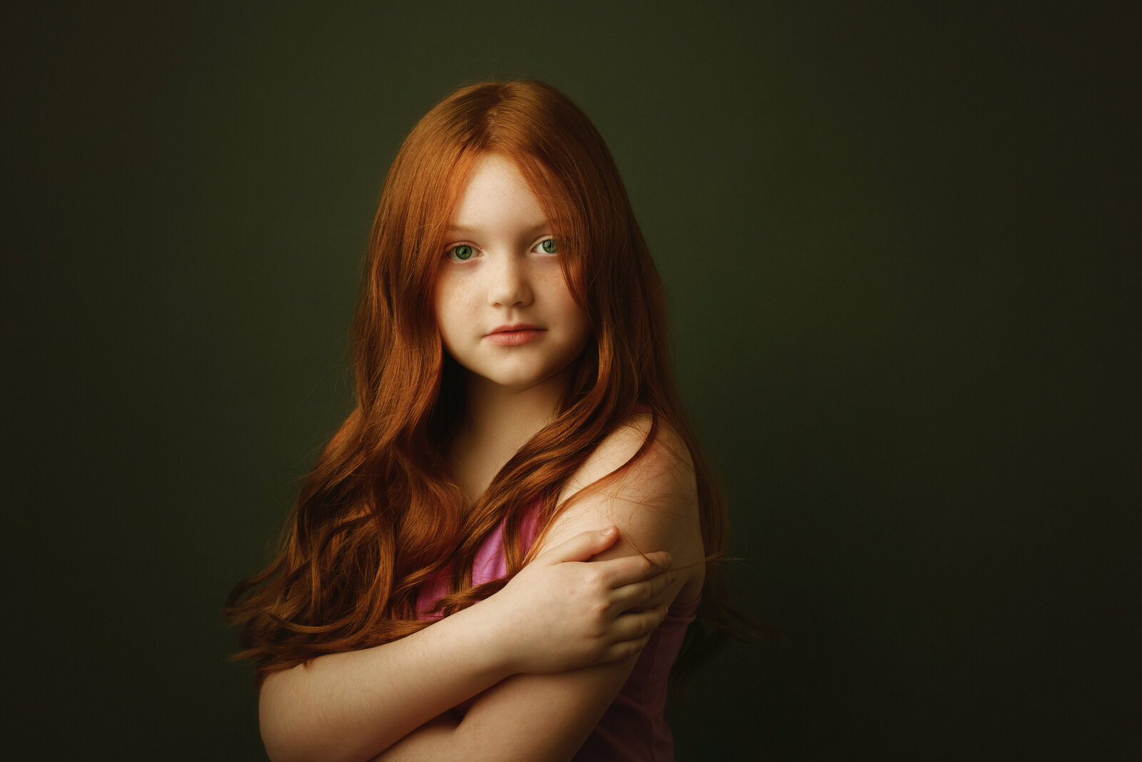 Portrait of a young girl, arms crossed and looking camera center. Luxury portraits.