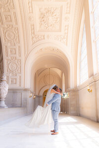 bride and groom lift at san francisco city hall wedding