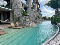 View of the river pool swimout suite at Hotel Xcaret Arte in Mexico