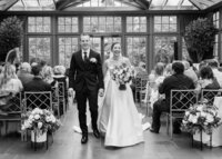 Bride and groom walk down the aisle after wedding at Royal Park hotel