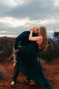 A couple kissing during their Las Vegas engagement session in Valley of Fire.