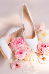 bride shoes with flowers flat lay at rainbow oaks ranch in sanger california
