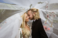 Bride and groom kissing during elopement in Iceland