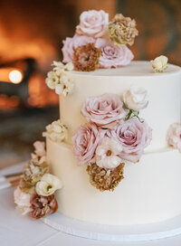 wedding cake decorated  with white and pink flowers