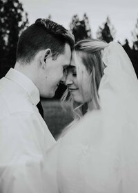 Maddie Rae Photography Bride and groom touching forheads