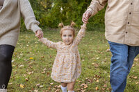 little girl holding hands in Family Photography near Shelby Township Michigan