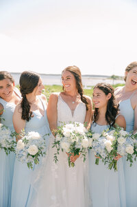 Bridal Party white bouquets and light blue bridesmaid dresses