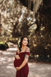 Maternity Photos in Charleston, SC -- Expectant mother poses for Maternity Portraits at Hampton Park in downtown Charleston, SC.
