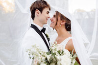 Knoxville Wedding Photographer capture bride and groom under veil after ceremony