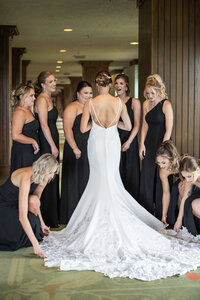 Omni Grove Park Inn wedding photography bridesmaids helping bride fluff dress Asheville, NC