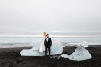 bride and groom looking in different directions at Diamond Beach Elopement Iceland Destination wedding photographer