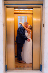 bride and groom in san francisco city hall elevator