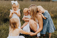 Mother and her 4 kids altogether in a field in Gatineau