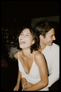 u3981682316_bride_laughing_with_her_head_thrown_back_while_gr_10437c19-34f7-4b2e-a3ea-766a7ad9a4e3_0