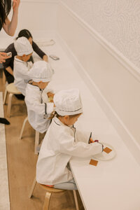Toddlers working on their culinary skills