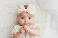 Four month old baby girl at her milestone session with Jennifer Brandes Photography.