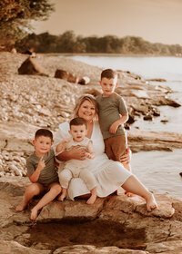 mother of three wonderful boys pose for their family photos outdoors by lake ontario oswego