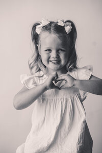 Little girl smiles at the camera during Personality Portrait Photoshoot in Charleston, SC.