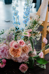 Pink and orange wedding arch photos