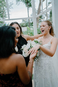 bride shwoig off her ring to her guest at the wedding the Julliana