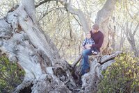 dad and toddler in a tree