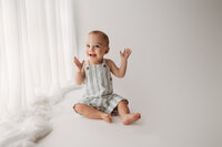 Baby celebrates his first birthday with Cake Smash Pictures at Holy City Babies Portrait Studio in Charleston, SC.