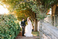 groom dips bride in garden at Eolia Mansion at Harkness State Park in CT