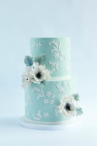 vintage blue wedding cake with lace and flowers