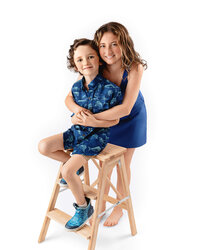 siblings in blue seated together in studio portrait in Eastern North Carolina
