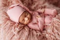 Infant posed for Newborn Baby Photos at Holy City Babies Portrait Studio in Charleston, SC.