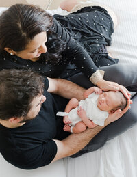 Image of new parents with their baby at a studio newborn photography session by Hobart Newborn Photographer, Lauren Vanier