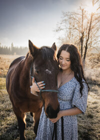 Sandy, Oregon high school senior with her horse up at Milo Mciver Park in Estacada Oregon