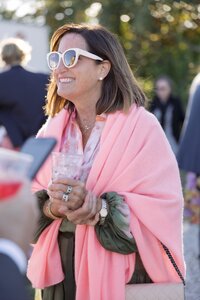 Guests enjoy outdoor cocktail hour during Nantucket wedding reception.