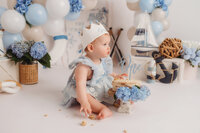 Baby celebrates her 1st birthday with a Cake Smash Photoshoot at Holy City Babies Portrait Studio in Charleston, SC.