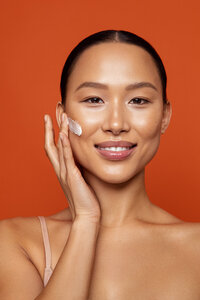 Steph Rose with a glowing smile, wearing fresh makeup in a dynamic beauty shot, photographed by Ylva Erevall.