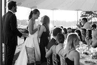 A bride holds her friend closely