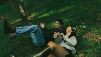 couple falling in grass together, cinematic motion blur couples photos, cinematic photographer, new york cinematic photographer, new york couples photographer, central park photographer, brooklyn couples photographer, documentary couples photographer